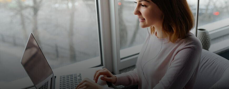 A young professional working on a laptop